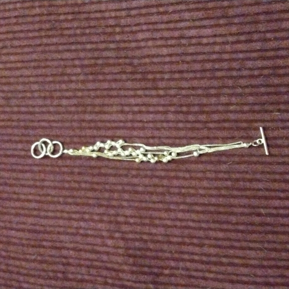 Silver adjustable toggle bracelets with silver balls on. - Picture 1 of 2